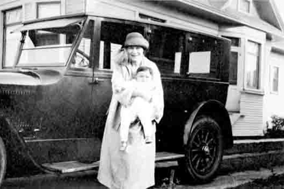 Robert Nakaya-Morton held by his mother Edith.